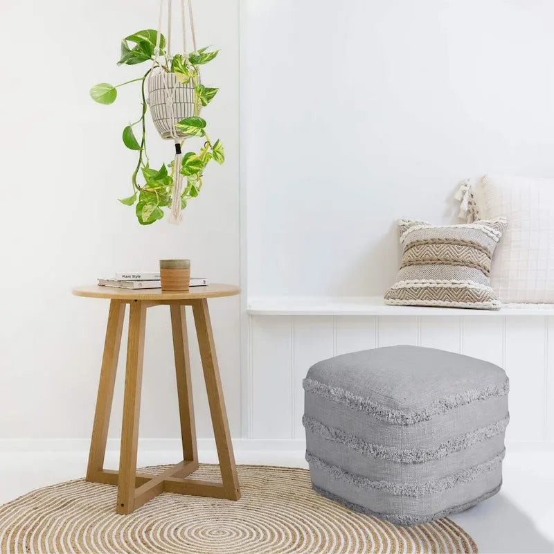 Pouf ottoman Sevita en tissu texturé rayé