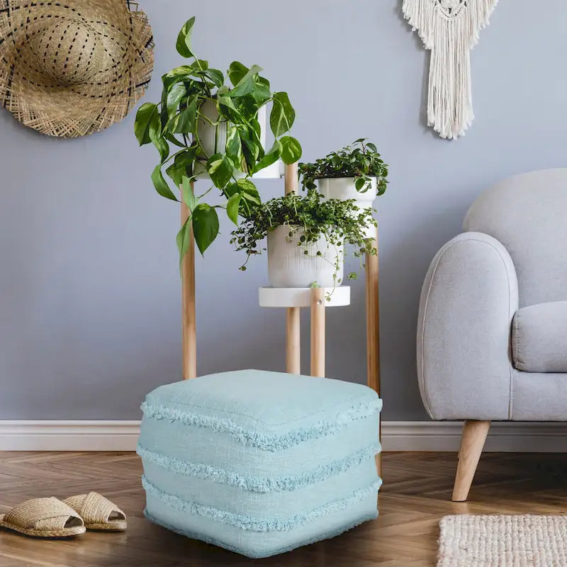 Pouf ottoman Sevita en tissu texturé rayé